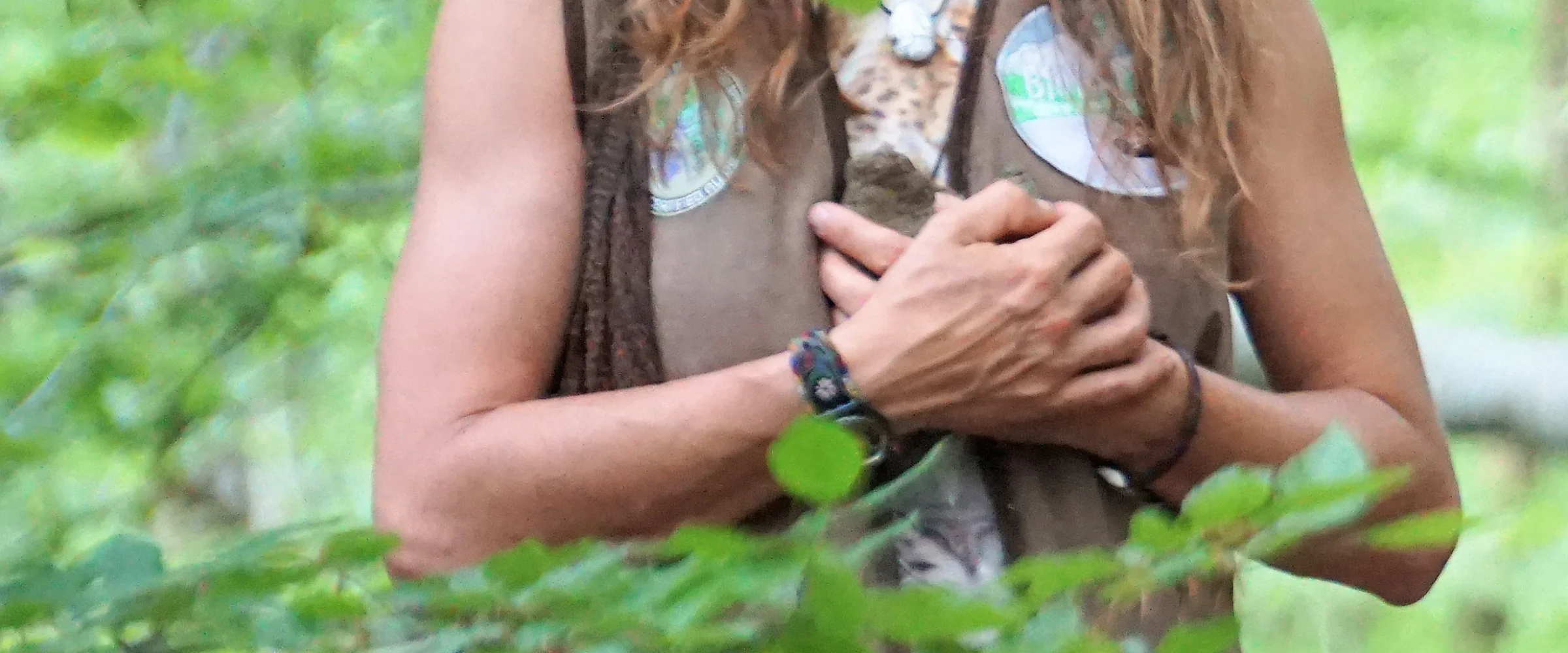 Hands resting gently on the heart